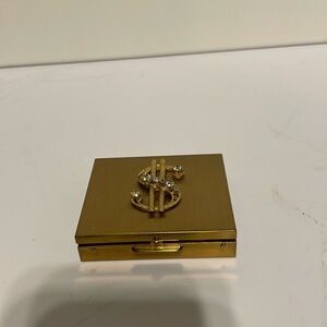 Vintage 1950s gold tone coin holder with rhinestones embellished dollar sign